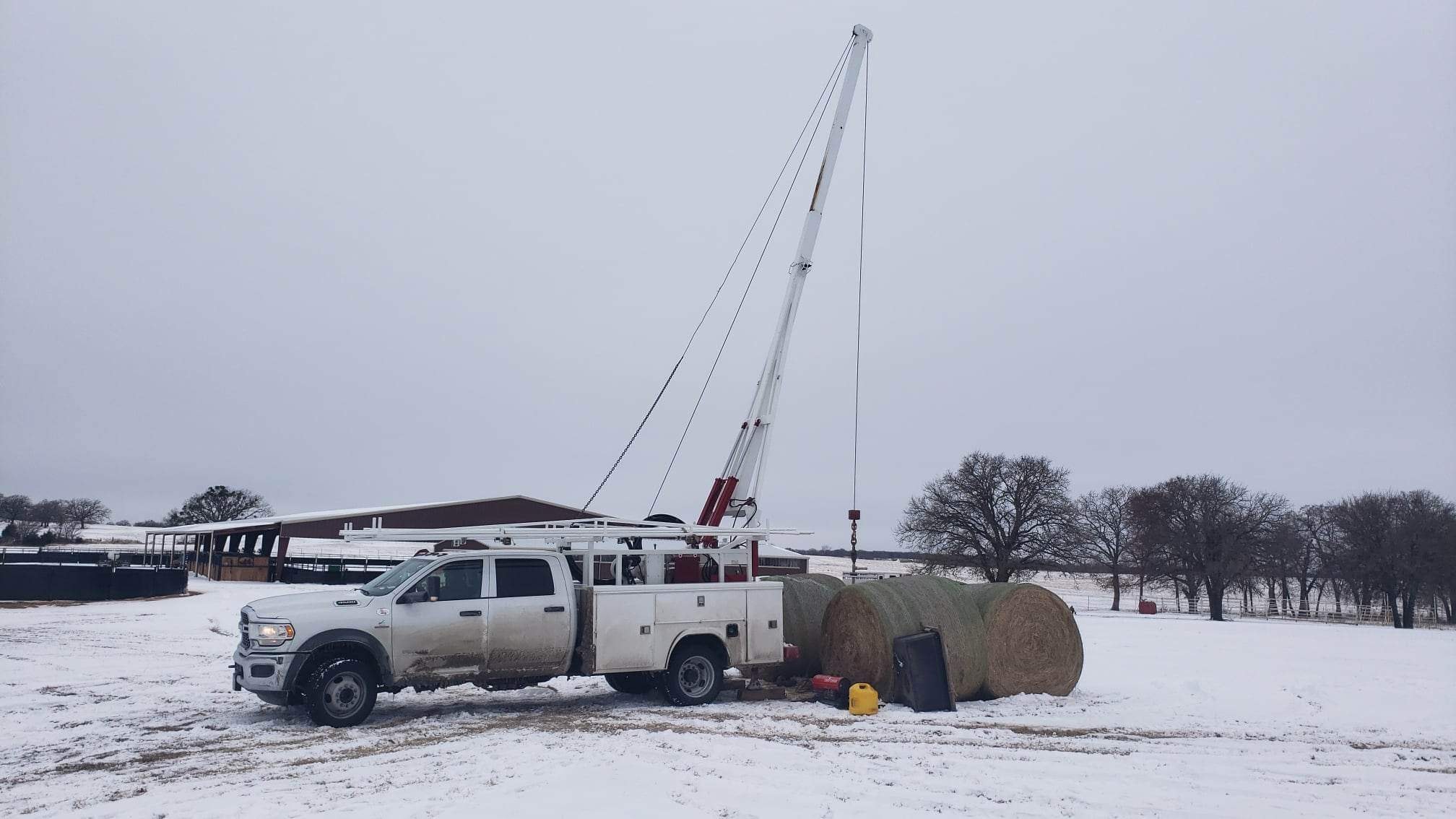 RW Water Wells service truck on a winter job site